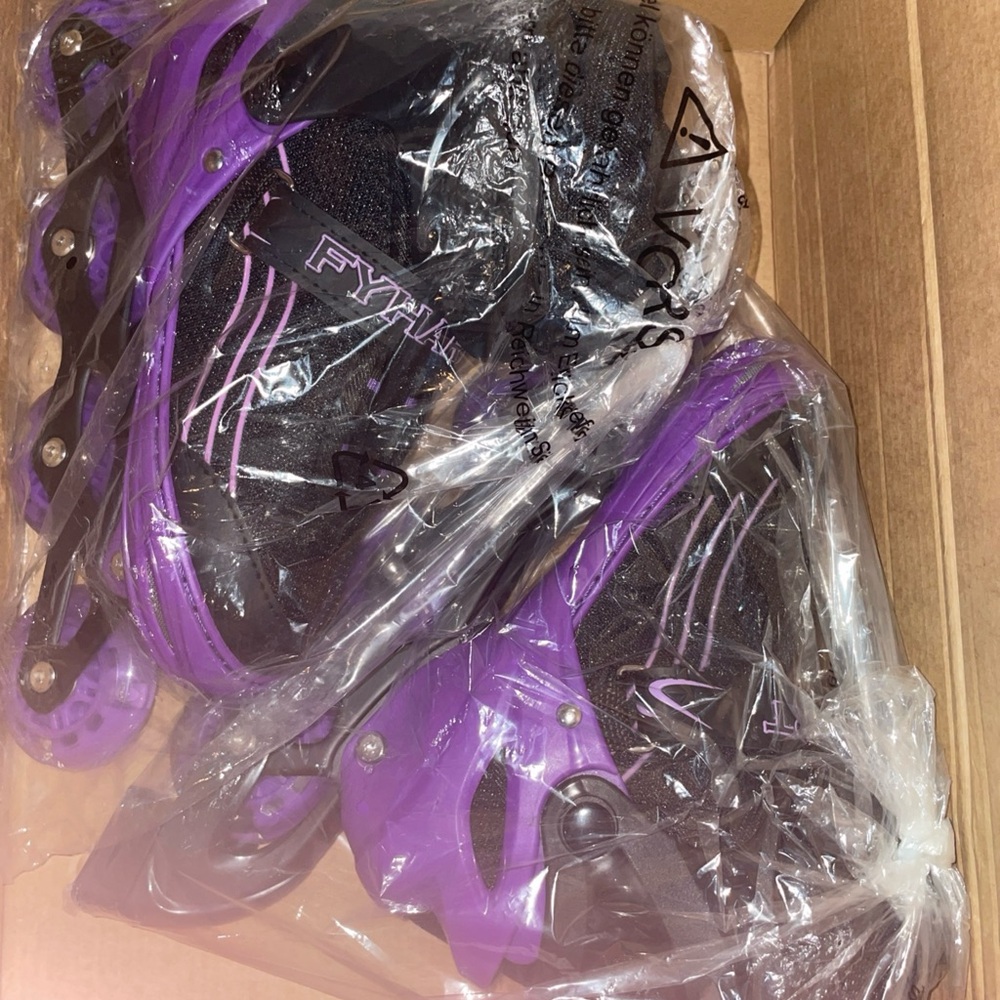 Purple and Black Rollerblades